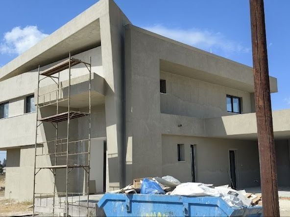 A building at construction stage with plastered walls